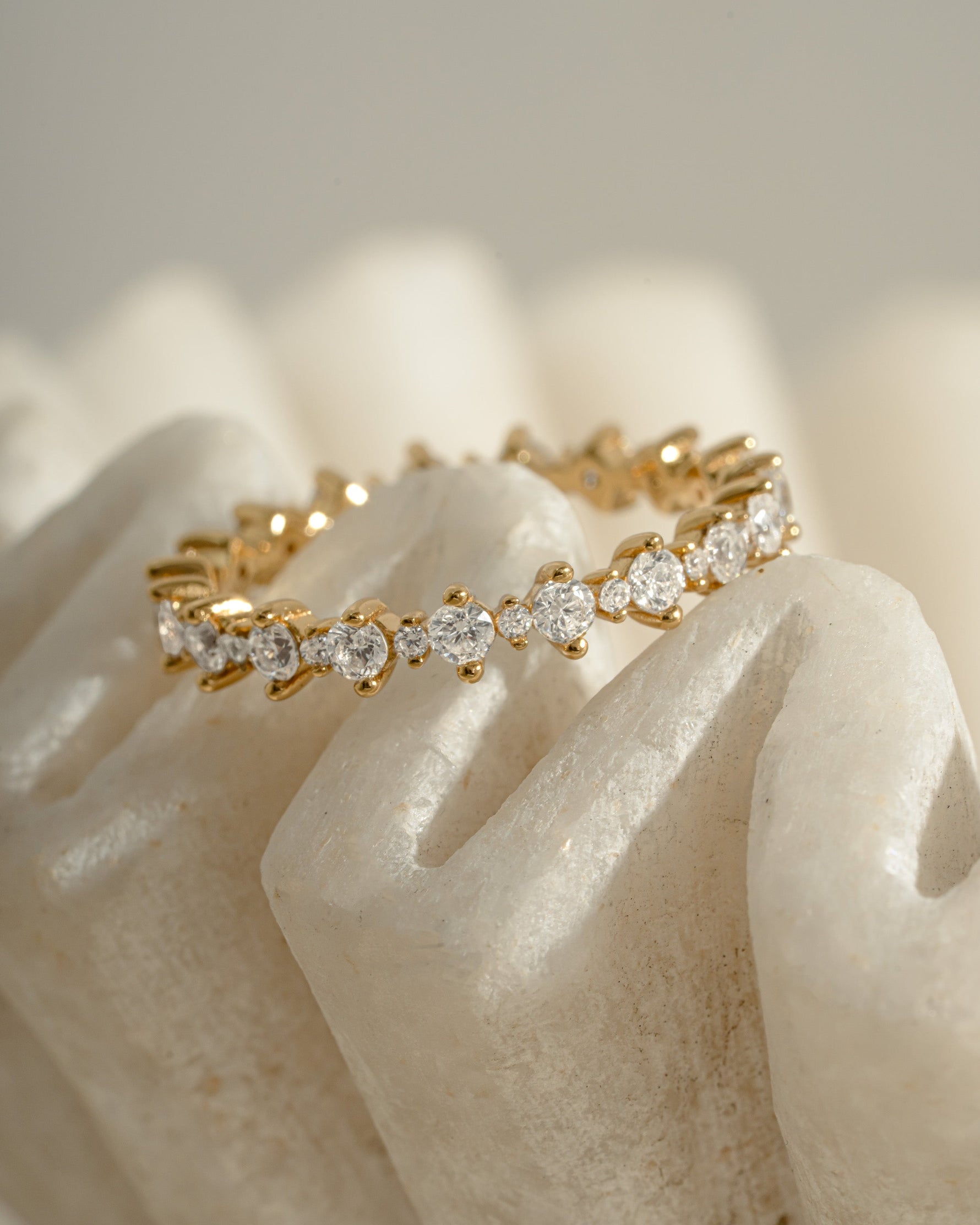 Close-up of Sami Jewels Rebecca Eternity Ring with diamond-studded gold band, showcasing intricate detailing and sparkling gemstones.