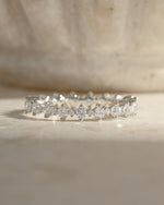 Sami Jewels Rebecca eternity ring with sparkling diamonds in sterling silver, featuring a continuous band of shimmering stones.