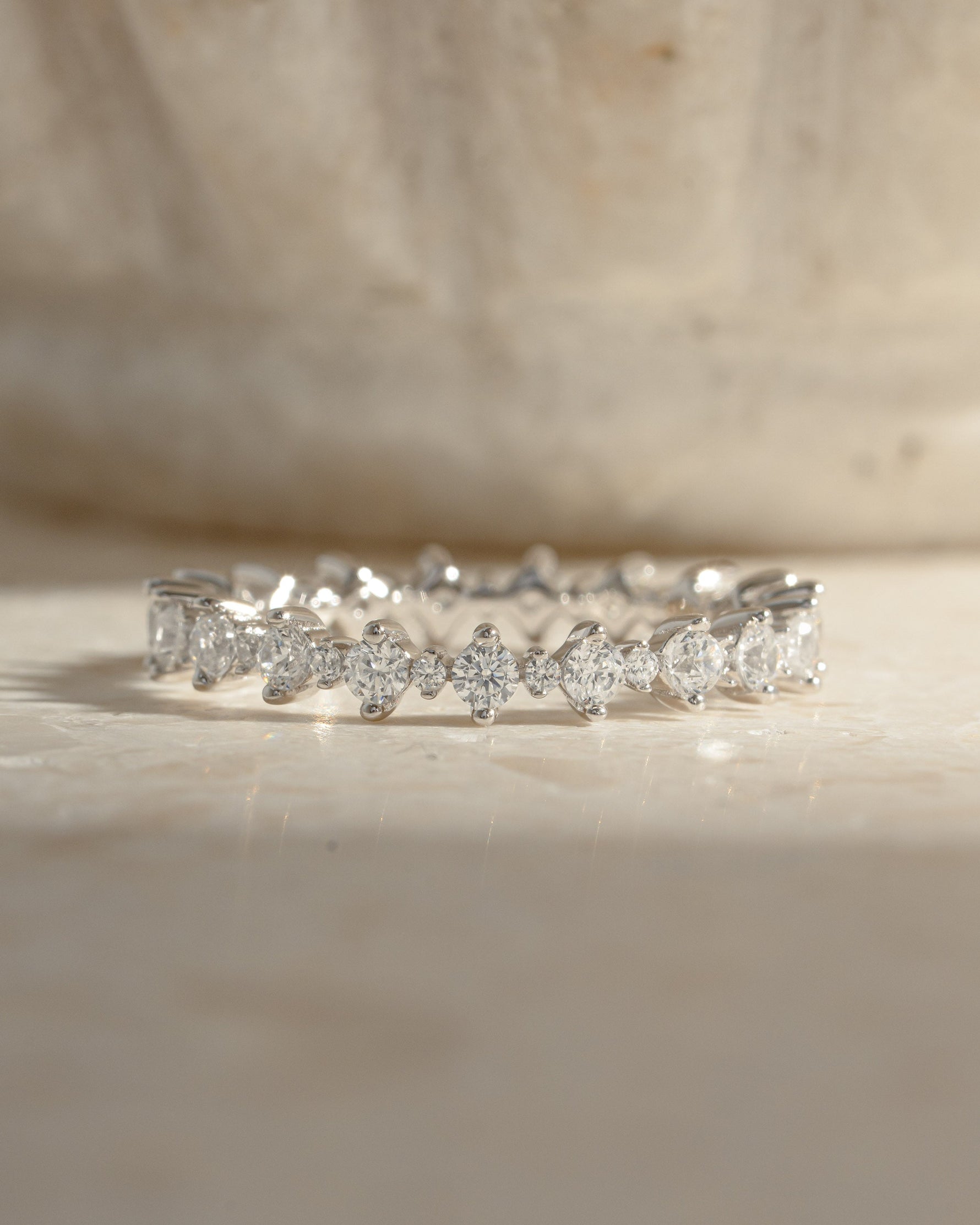 Sami Jewels Rebecca eternity ring with sparkling diamonds in sterling silver, featuring a continuous band of shimmering stones.