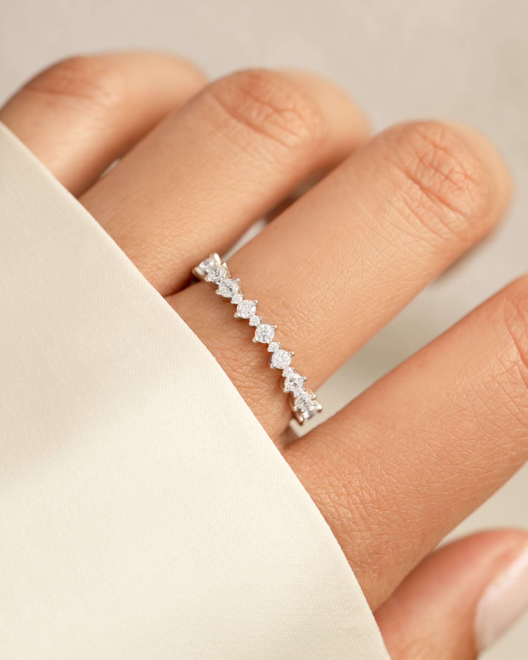 Sami Jewels Rebecca Eternity Ring featuring sterling silver band with sparkling diamond accents for a continuous elegant design.