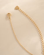 Gold diamond flower necklace with a charming pendant and lobster clasp closure, by SJ Faire.