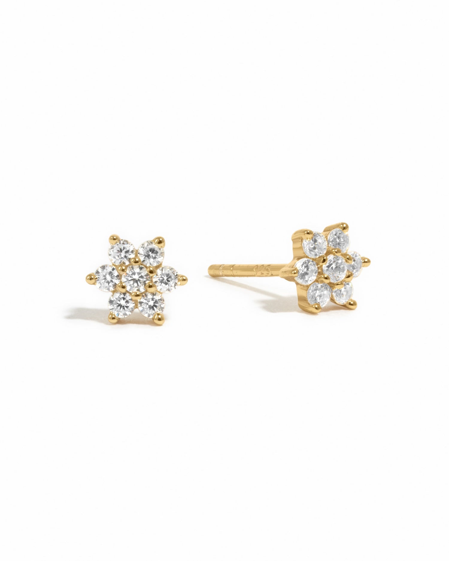 diamond flower stud earring in gold on a white background