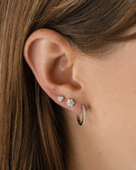 Sterling silver diamond flower studs earrings from Sami Jewels featuring sparkling gemstone accents.