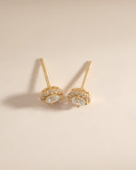 Gold diamond halo stud earrings by Sami Jewels, featuring sparkling diamond accents in a classic stud design.