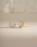 Gold diamond halo stud earrings by Sami Jewels featuring sparkling round diamonds and a classic, elegant design.