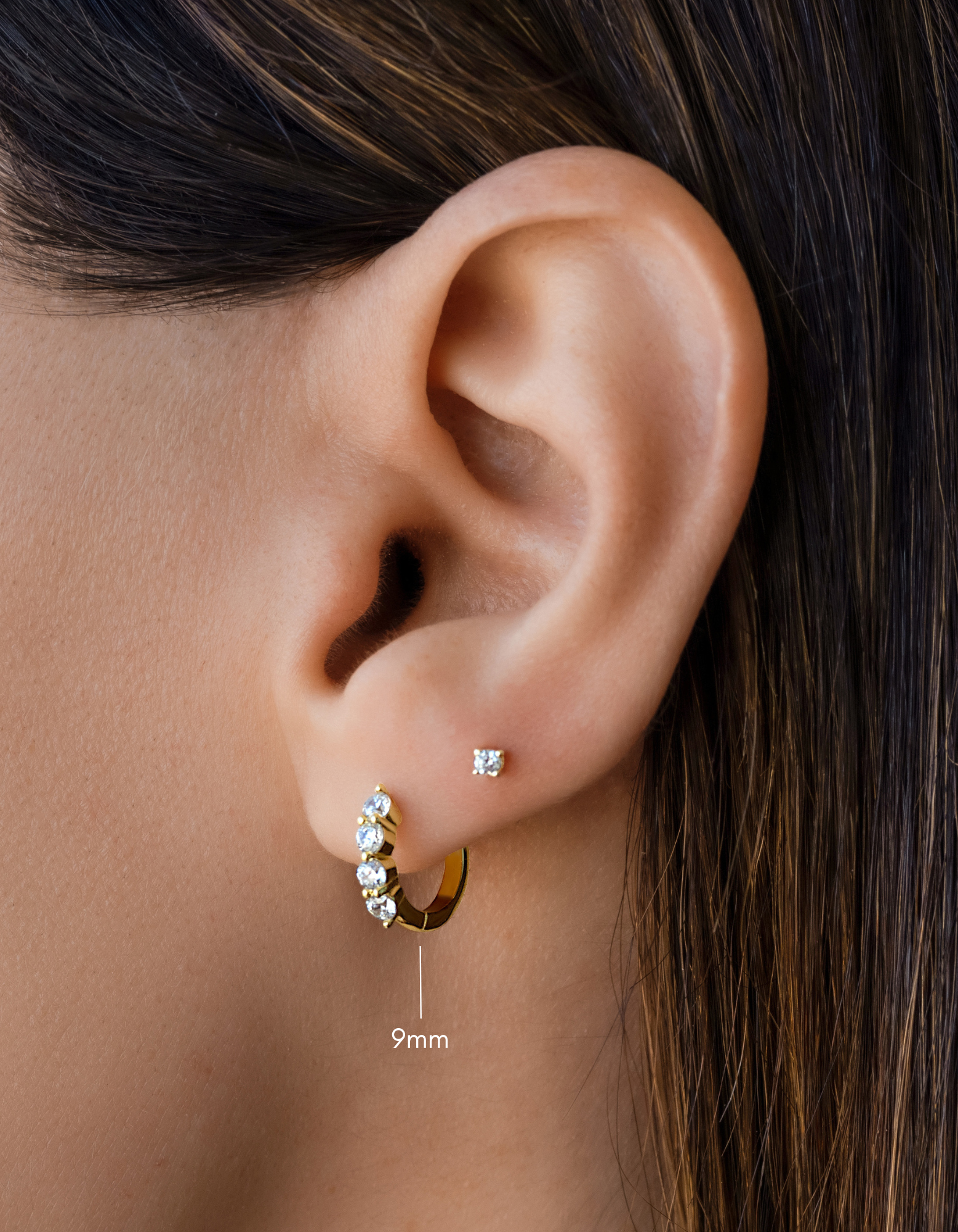 diamond huggie hoop earrings in 9mm in gold on models ear