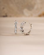 9mm sterling silver Stacy hoop earrings by Sami Jewels featuring diamond-huggie design, shown from a side view.