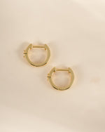 Gold diamond Huggie Hoop Earrings by Sami Jewels, side profile view showcasing their elegant design and sparkling accents.