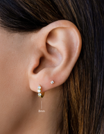 three stone diamond huggie hoop, 8mm in gold on model