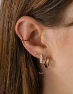 9mm gold Stacy hoop earrings by Sami Jewels featuring diamond accents on small huggie-style hoops.