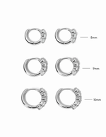 three stone diamond huggie hoop earring in sterling silver infographic on white background