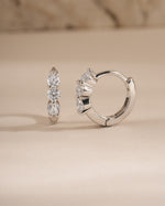 Sterling silver 8mm Stacy hoop earrings by Sami Jewels featuring diamond-huggy design and classic hoop style.