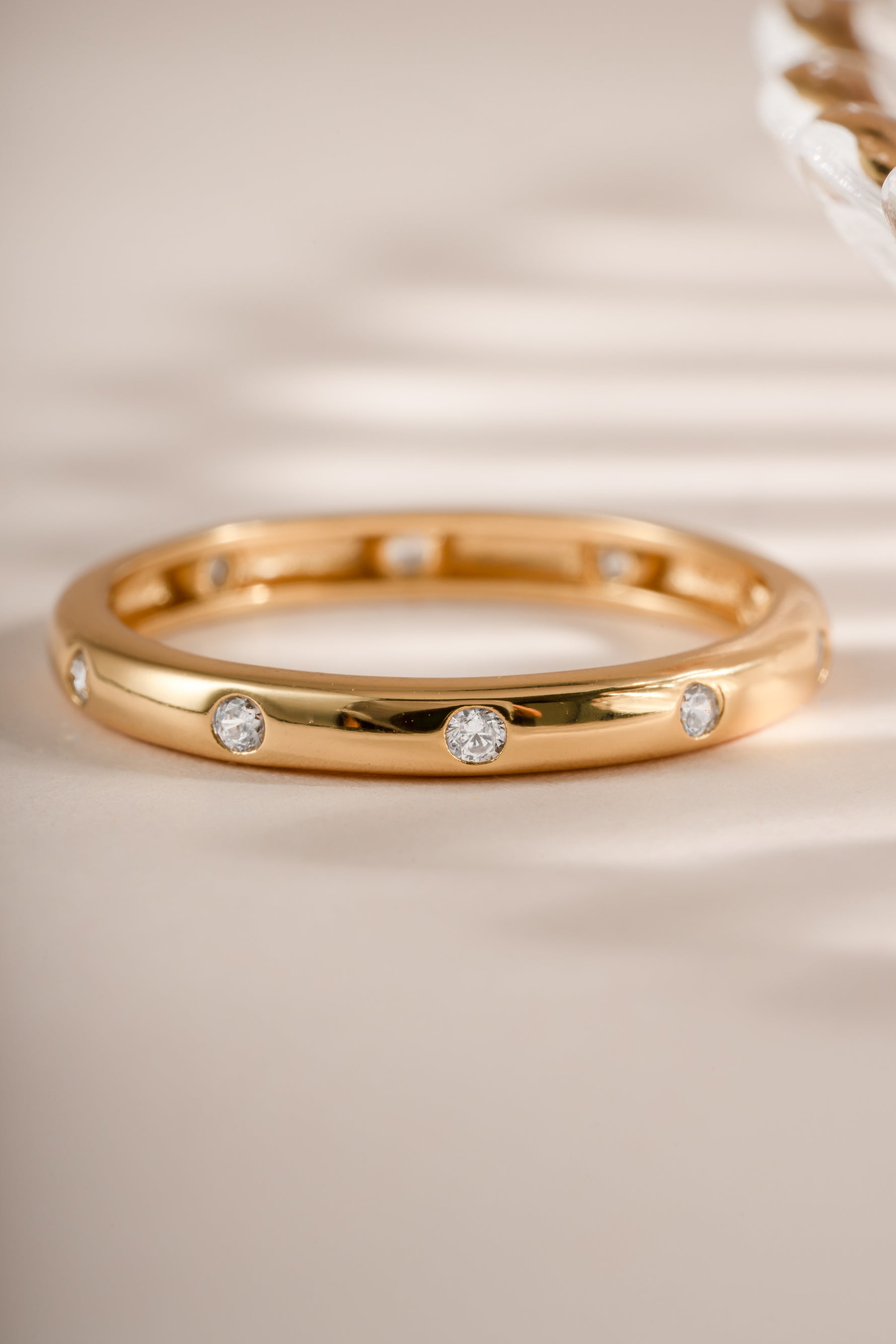 Close-up of Sami Jewels diamond multi-stone gold ring showcasing sparkling multi-faceted gemstones and intricate band design.