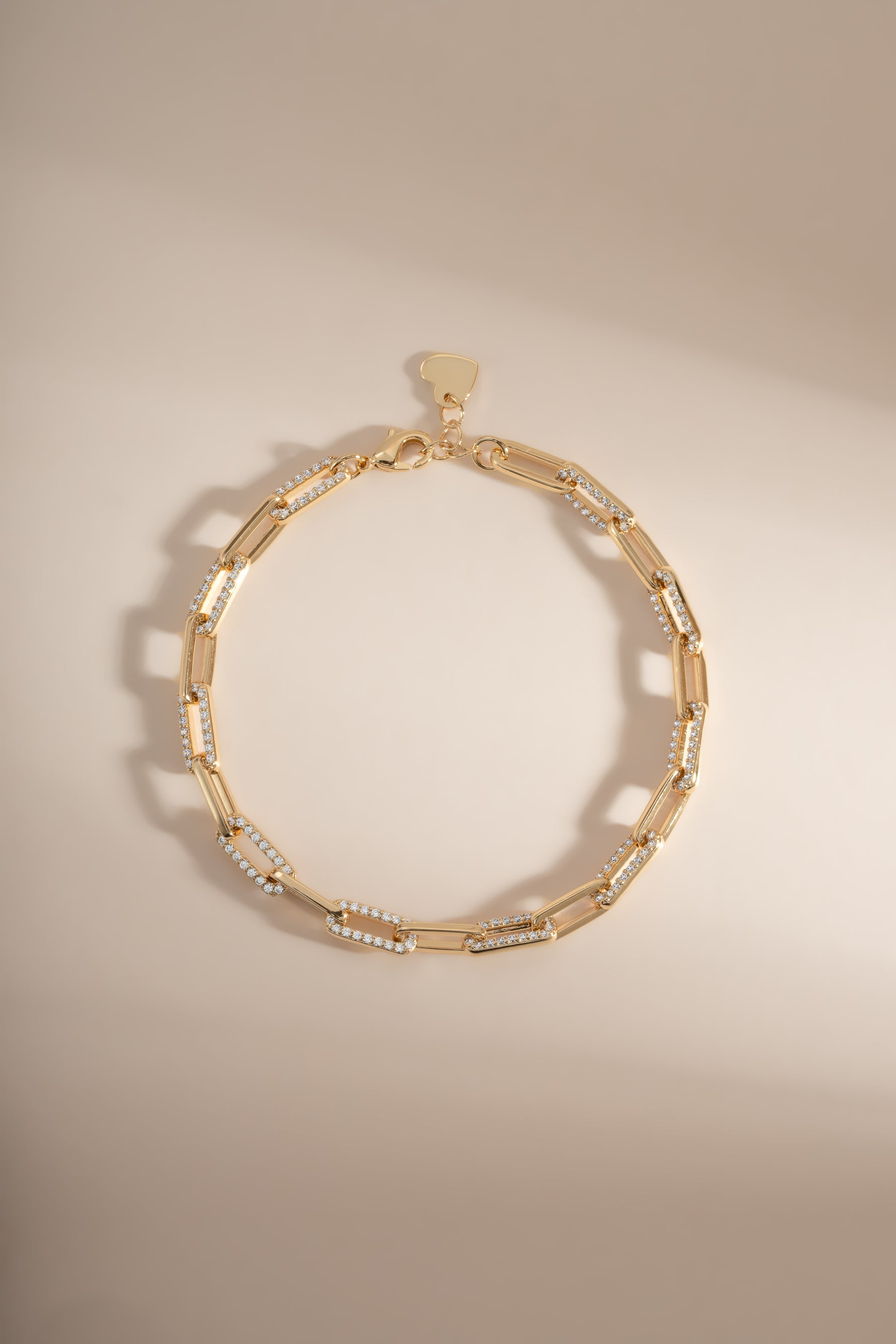 Gold diamond paperclip bracelet by Sami Jewels featuring a sleek design and sparkling diamond accents, front view.