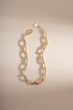 Gold diamond paperclip bracelet by Sami Jewels with lobster clasp closure, featuring sleek, modern jewelry design.