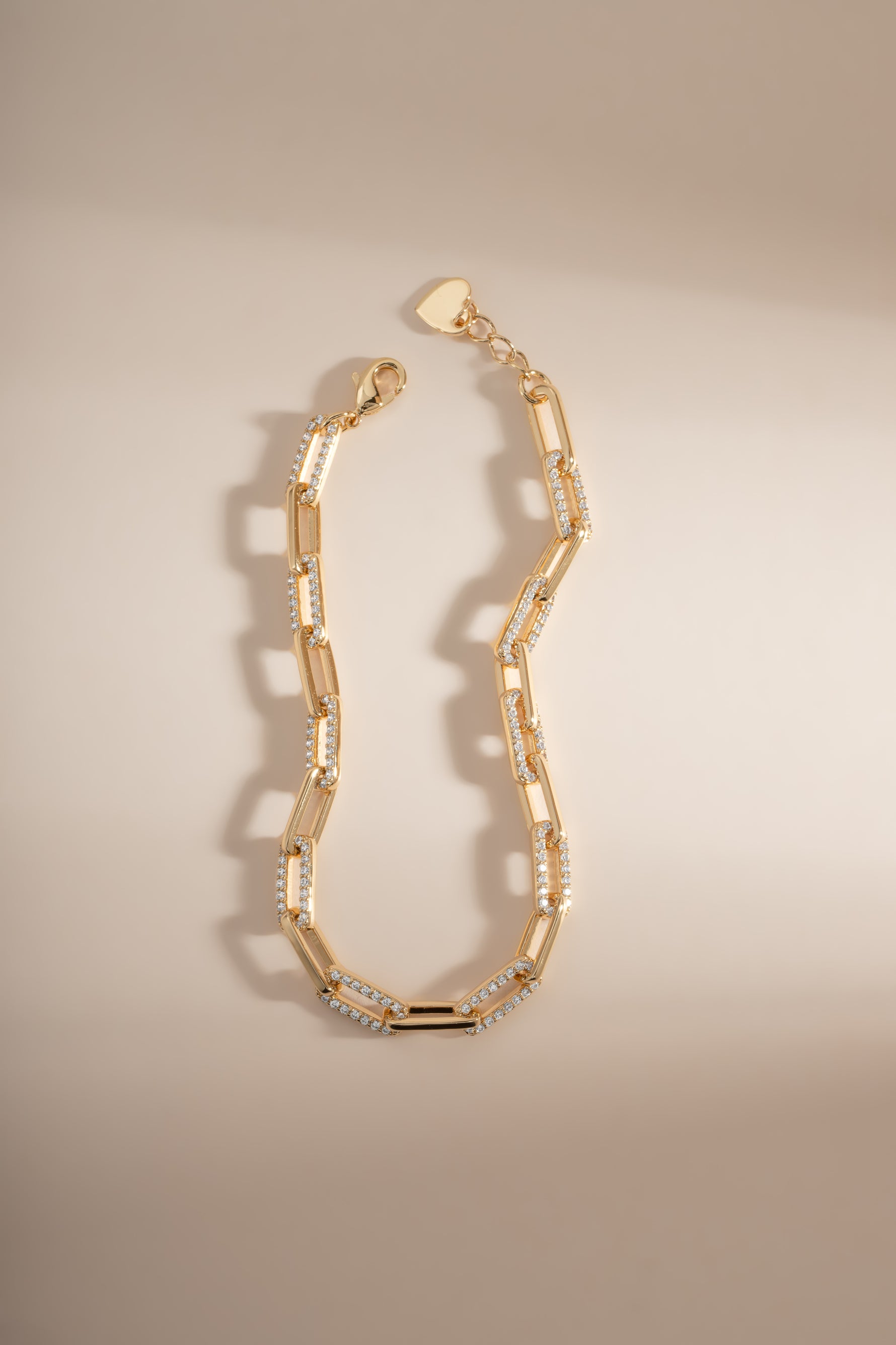 Gold diamond paperclip bracelet by Sami Jewels with lobster clasp closure, featuring sleek, modern jewelry design.