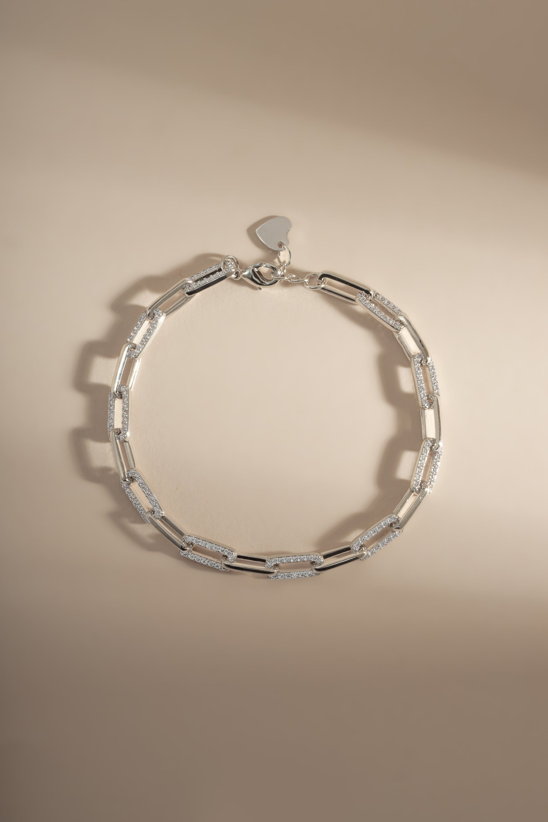Silver diamond paperclip bracelet by Sami Jewels with a lobster clasp, featuring a sleek, modern design.