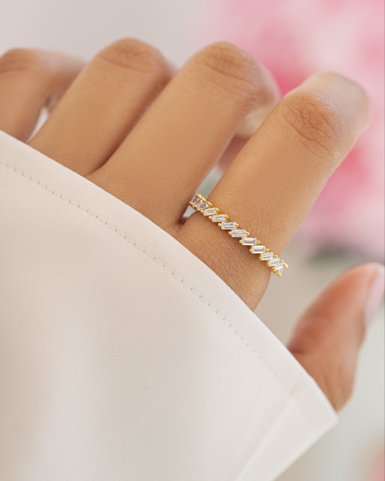 Gold slanted white CZ baguette ring from Samijewels-527 featuring a sleek, modern design with sparkling baguette-cut stones.