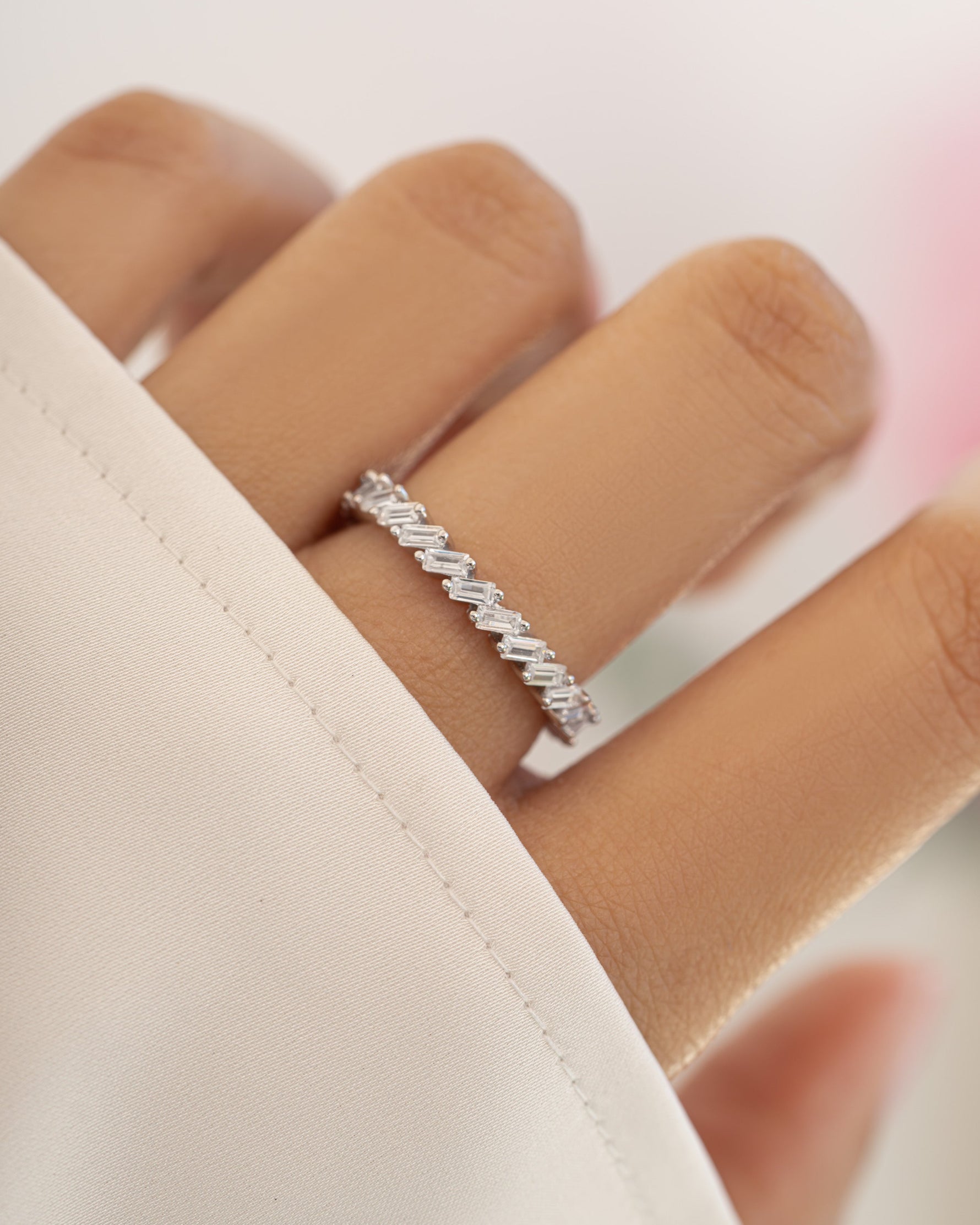 Sterling silver Sami Jewels slanted white CZ baguette ring featuring a modern geometric design.