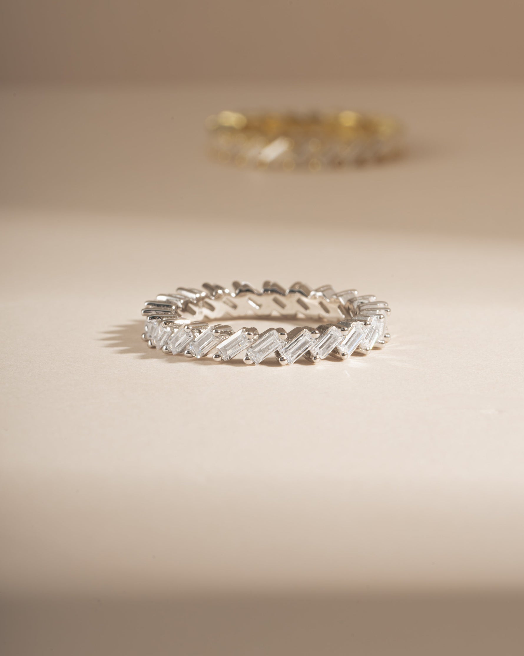Sterling silver slanted white CZ baguette ring by Sami Jewels featuring geometric design and sparkling gemstone accents.