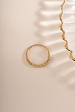 Gold Bianca stacking ring by Sami Jewels with diamond accents, shown from a top view highlighting its elegant design.