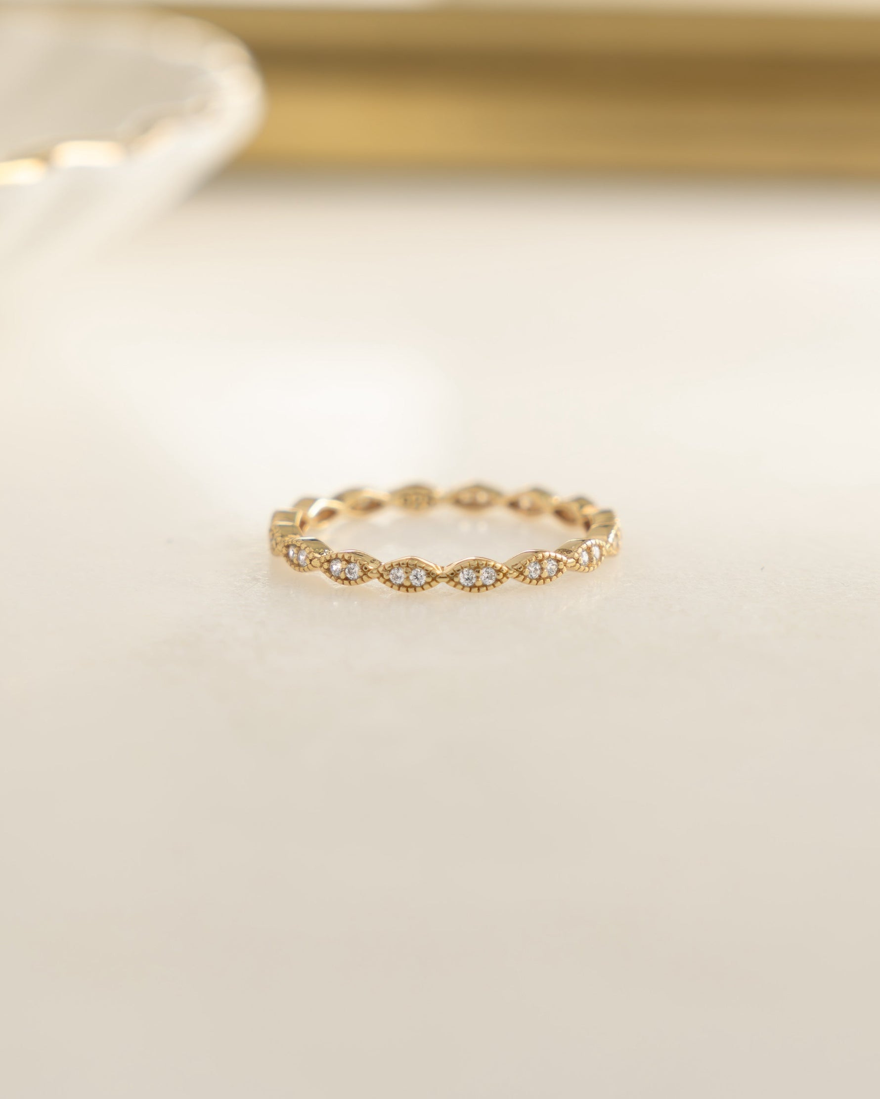 Gold diamond stacking ring from Sami Jewels featuring sparkling diamonds and a sleek, modern design.