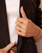Gold Bianca stacking ring with diamond accents from Sami Jewels, showcasing a stylish layered jewelry design.