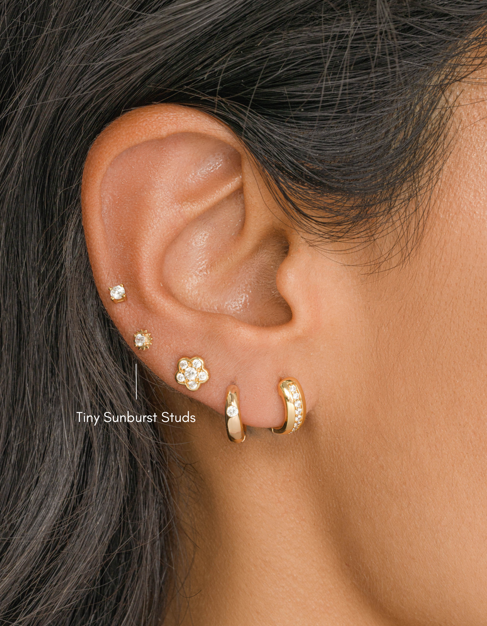 Gold CZ Tiny Sunburst Stud Earrings by Sami Jewels featuring sparkling diamond-like sunburst design.