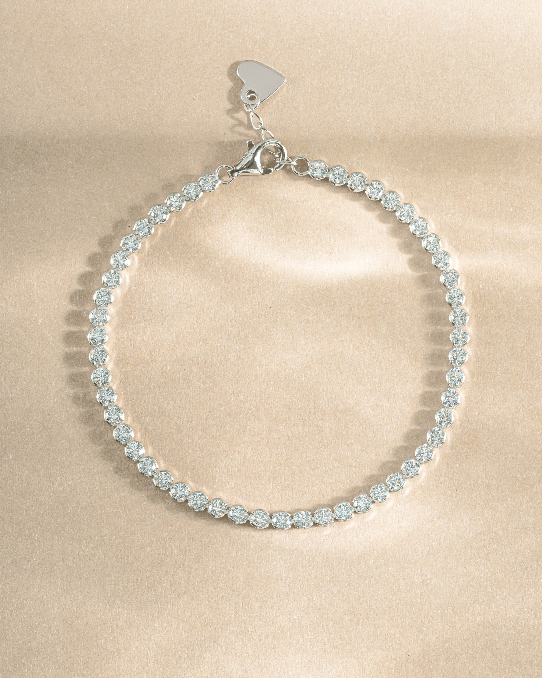 Sami Jewels 3mm round diamond tennis bracelet in sterling silver, top view showcasing sparkling gemstones and elegant design.