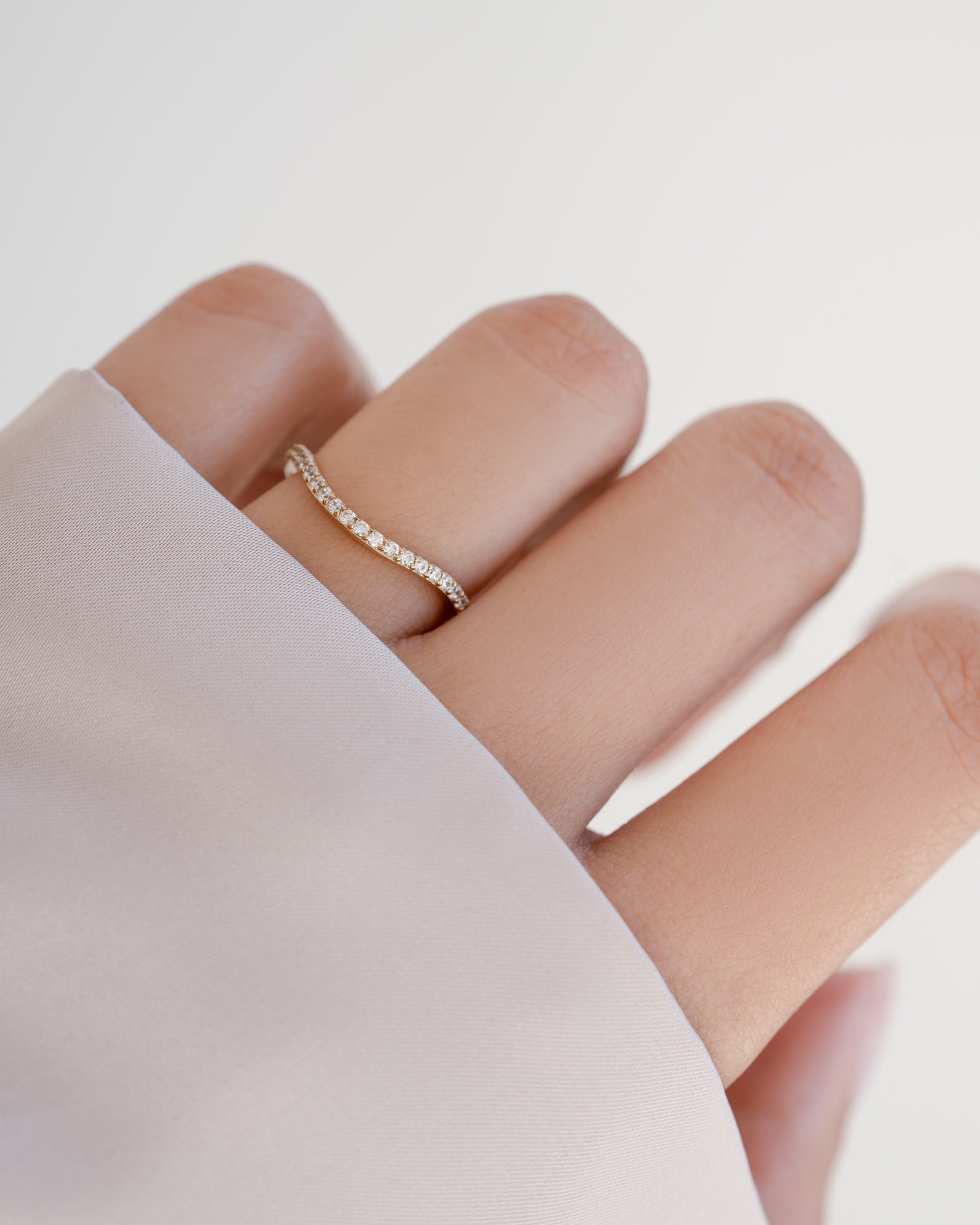 Gold Toi Et Moi matching wedding band rings by Sami Jewels with diamond accents, displayed on a model's finger.
