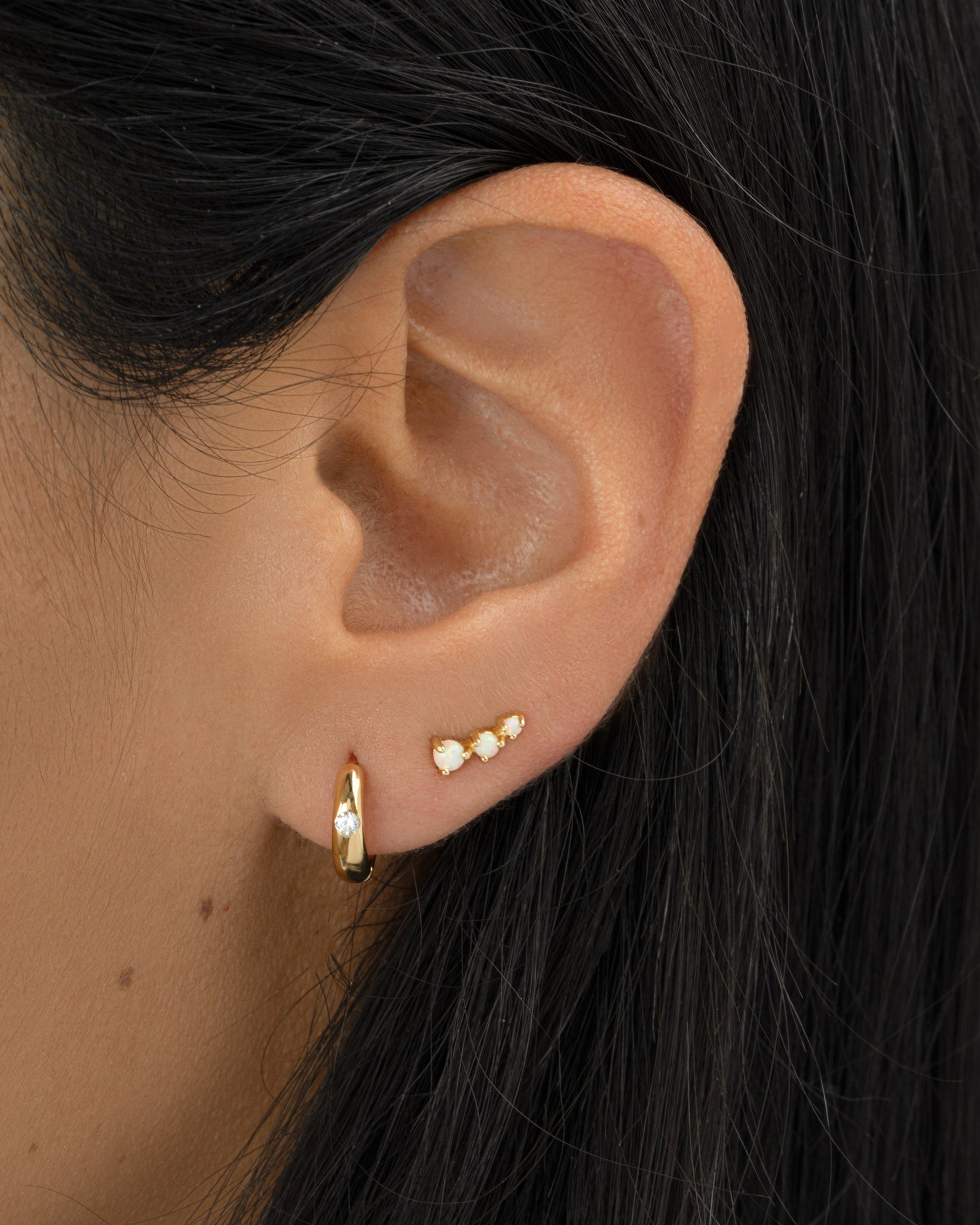 Gold Dome Diamond Huggie Earrings by Sami Jewels featuring sparkling diamonds and a sleek, rounded design.
