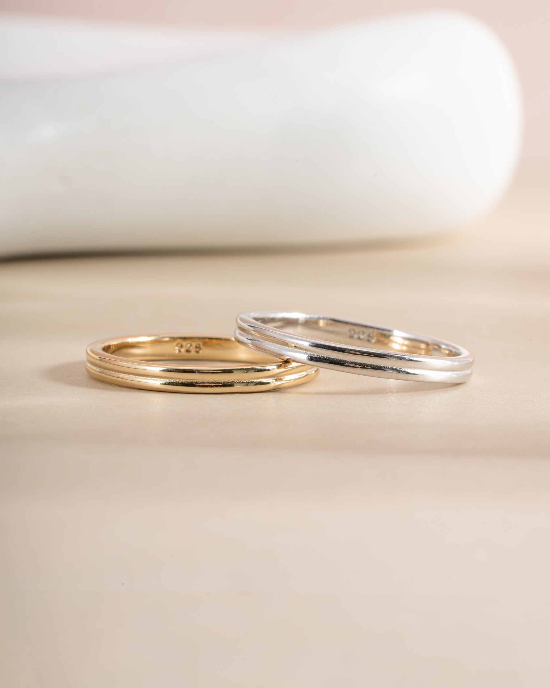 Gold and sterling silver double band ring by Sami Jewels, featuring sleek, layered design with polished finishes.