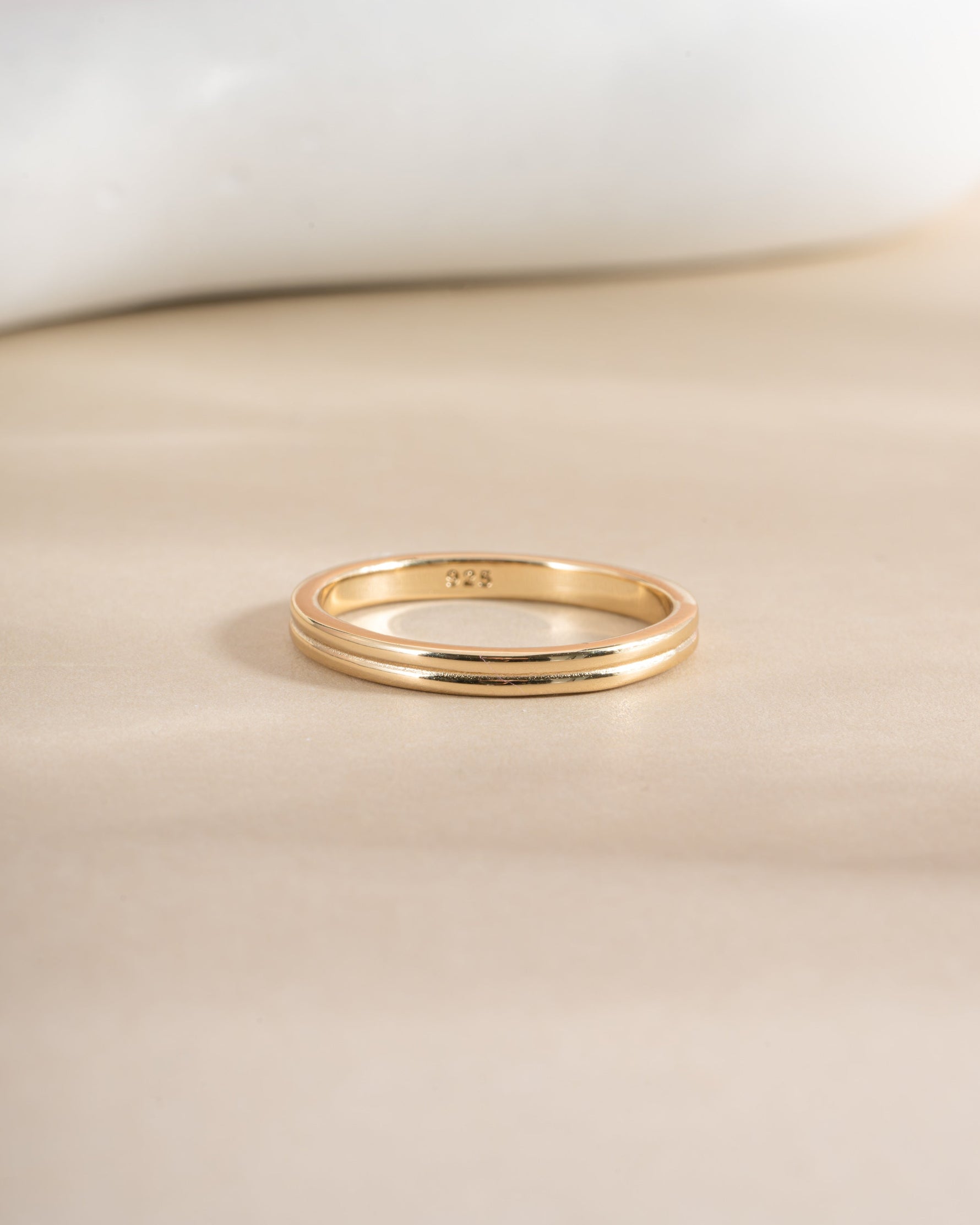 Gold double band ring from Sami Jewels, front view showing two interconnected bands with smooth, polished finish.