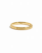 Gold double band ring by Sami Jewels featuring sleek design, displayed on a white background.