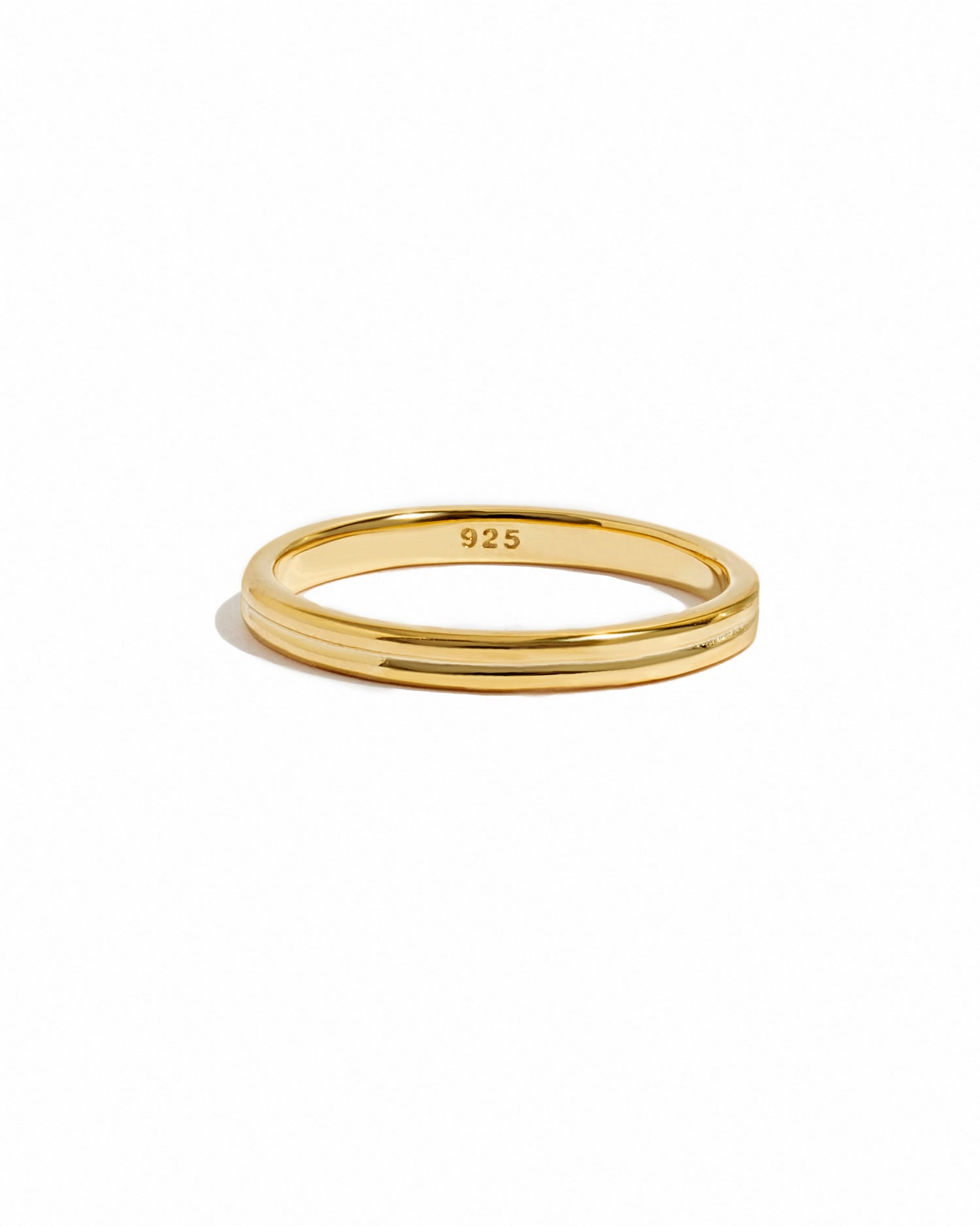 Gold double band ring by Sami Jewels featuring sleek design, displayed on a white background.