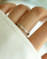 Sterling silver double band ring from Sami Jewels featuring a sleek, modern design, worn on a model's finger.