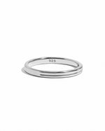 Sterling silver double band ring by Sami Jewels displayed against a white background.
