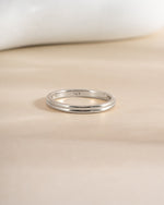 Sterling silver double band ring by Sami Jewels featuring intertwined sleek bands for a modern jewelry look.