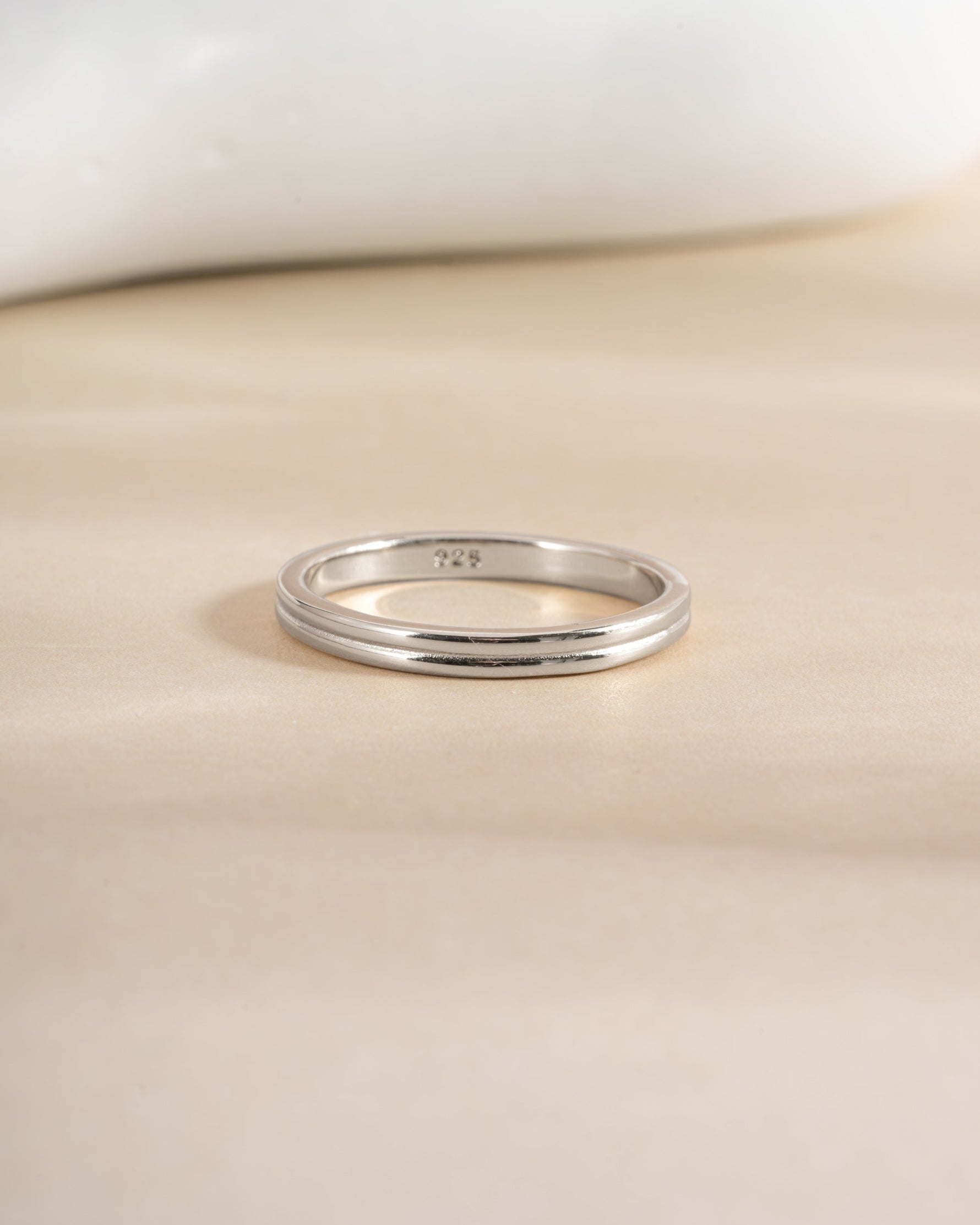 Sterling silver double band ring by Sami Jewels featuring intertwined sleek bands for a modern jewelry look.