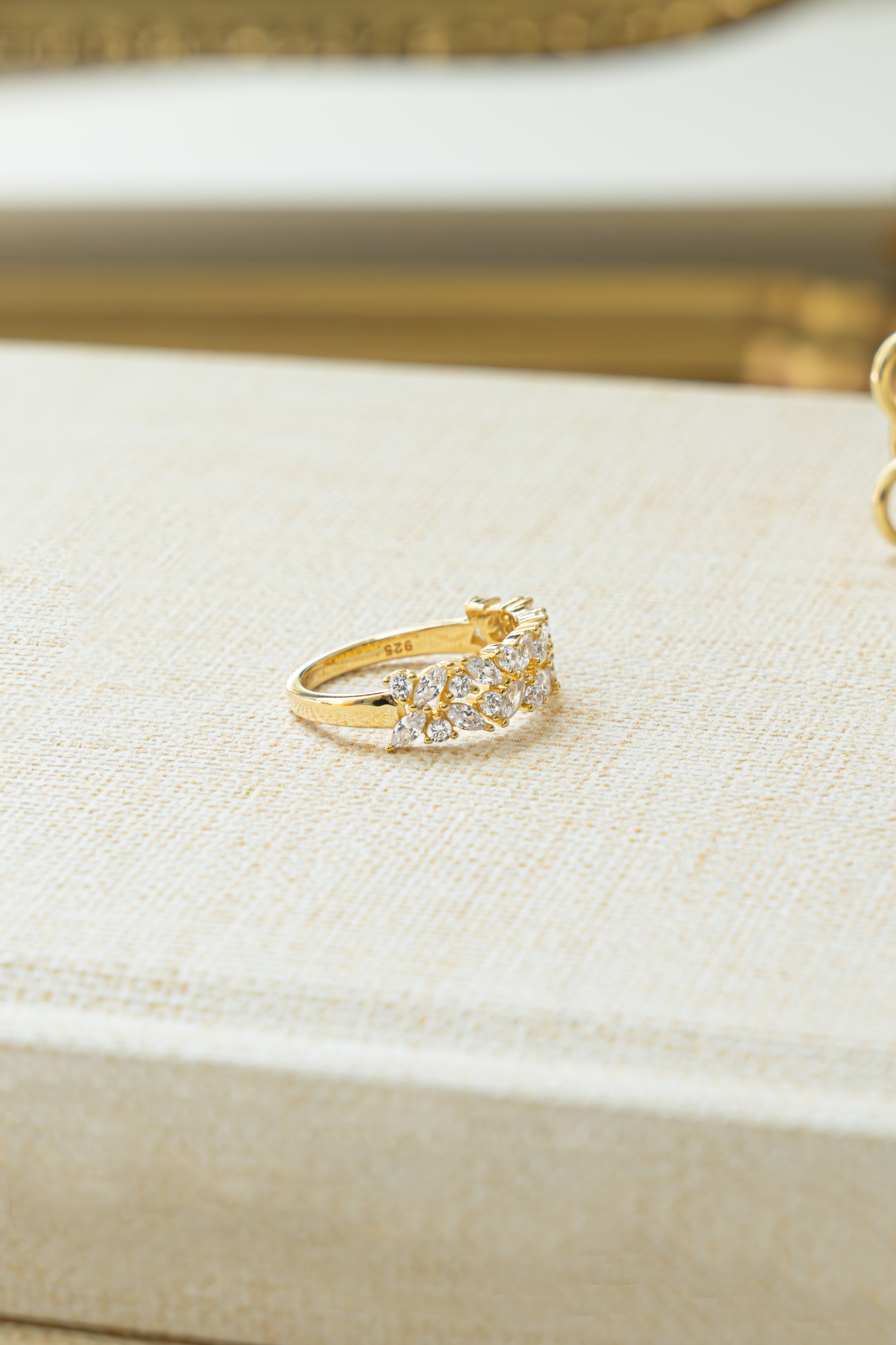 Gold Double Cluster Ring by Sami Jewels showcasing two sparkling gemstone clusters on a sleek band.