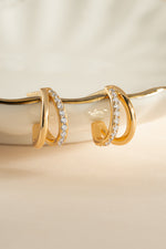 Gold double diamond hoop earrings by Sami Jewels, showcasing elegant and sparkling jewelry design with intricate diamond details.