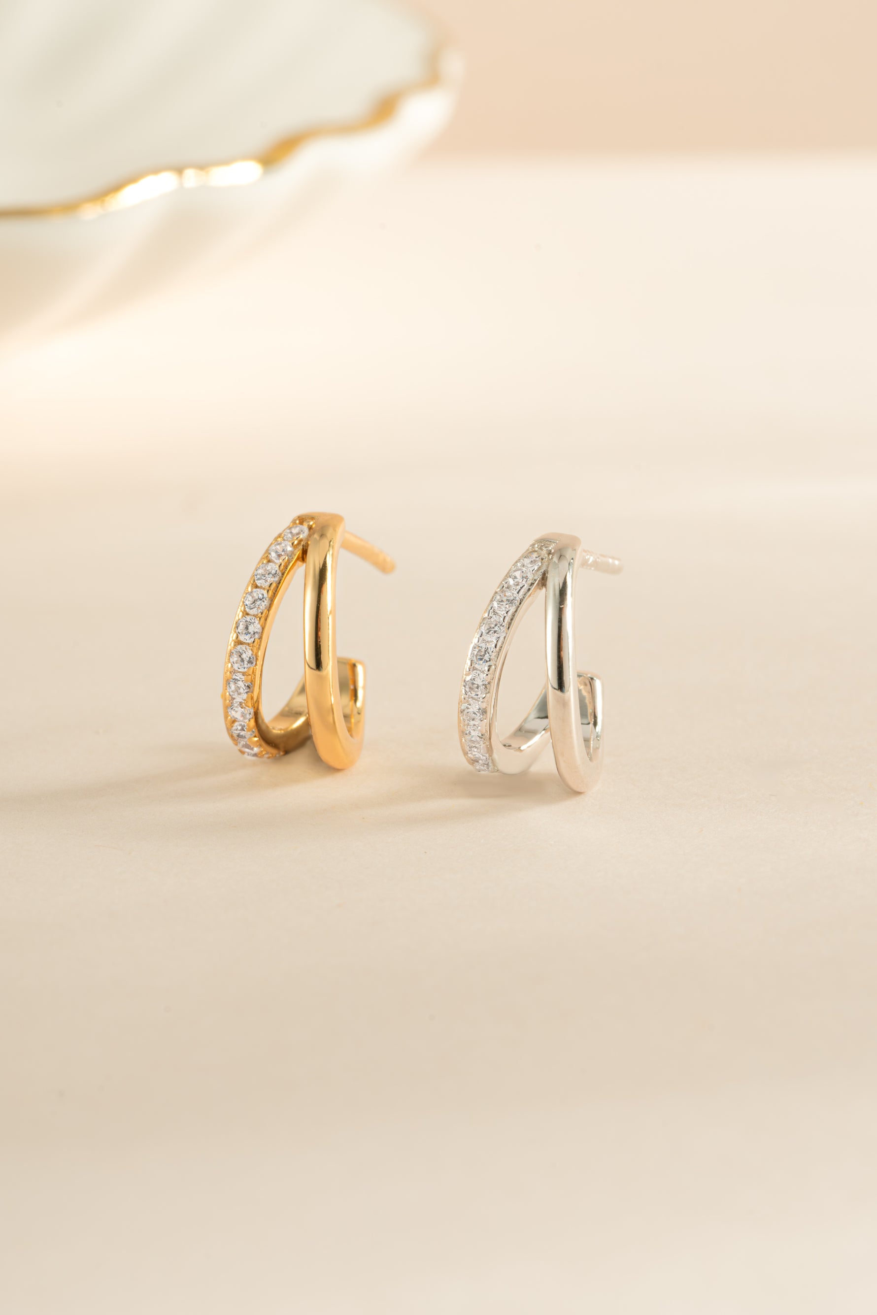 Gold and sterling silver double diamond hoop earrings by Sami Jewels featuring sleek, modern design.