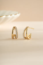 Gold double diamond hoop earrings from Sami Jewels featuring sleek, modern design with sparkling diamond accents.