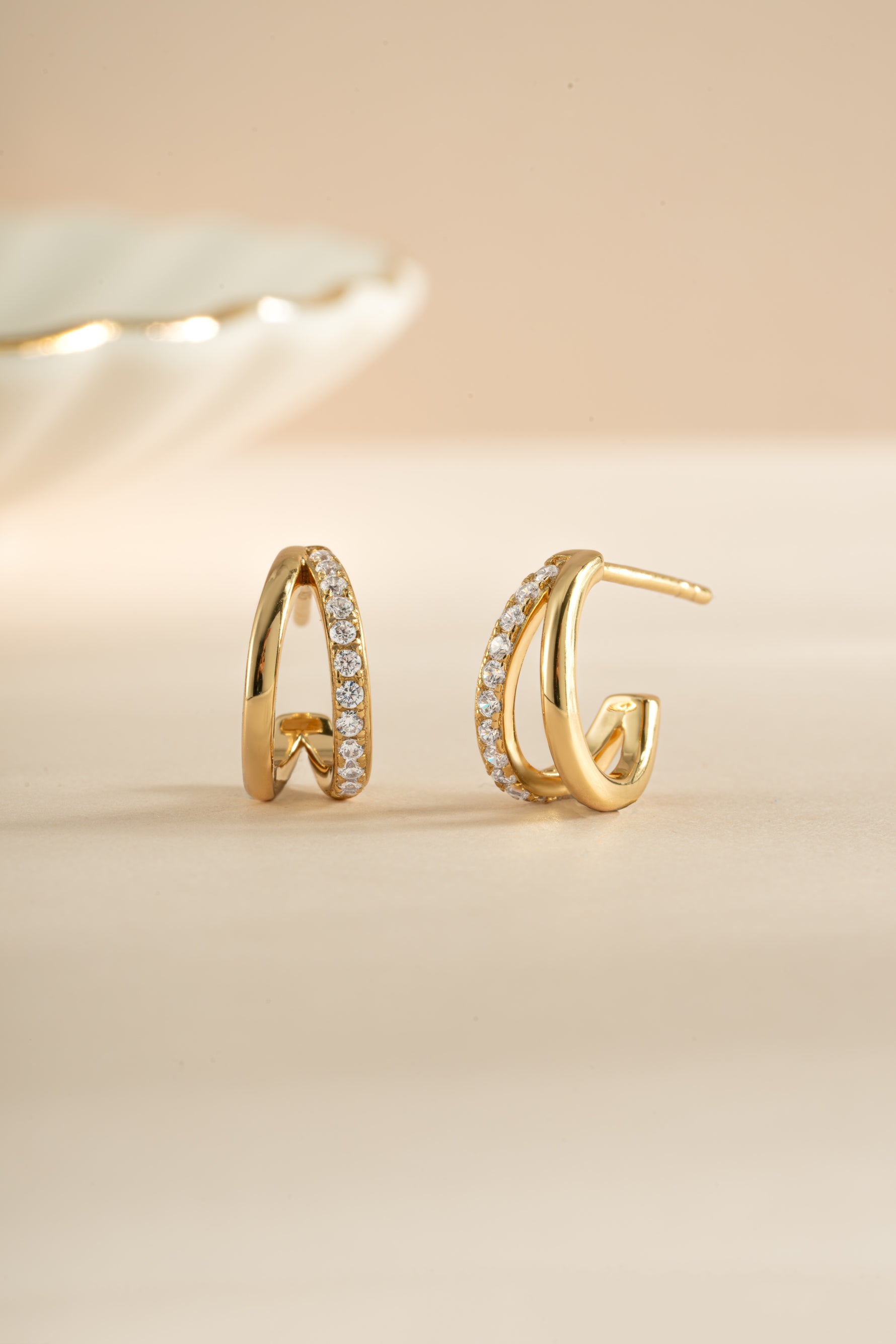 Gold double diamond hoop earrings from Sami Jewels featuring sleek, modern design with sparkling diamond accents.