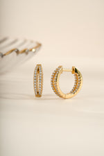 Gold double hoop earrings from Sami Jewels, featuring an angled view of stylish, modern double hoop design.
