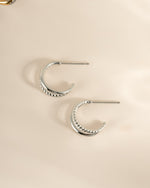 Sami Jewels Stella Hoop Earrings in sterling silver, double-hoop design, side view showing shiny, polished finish and classic style.