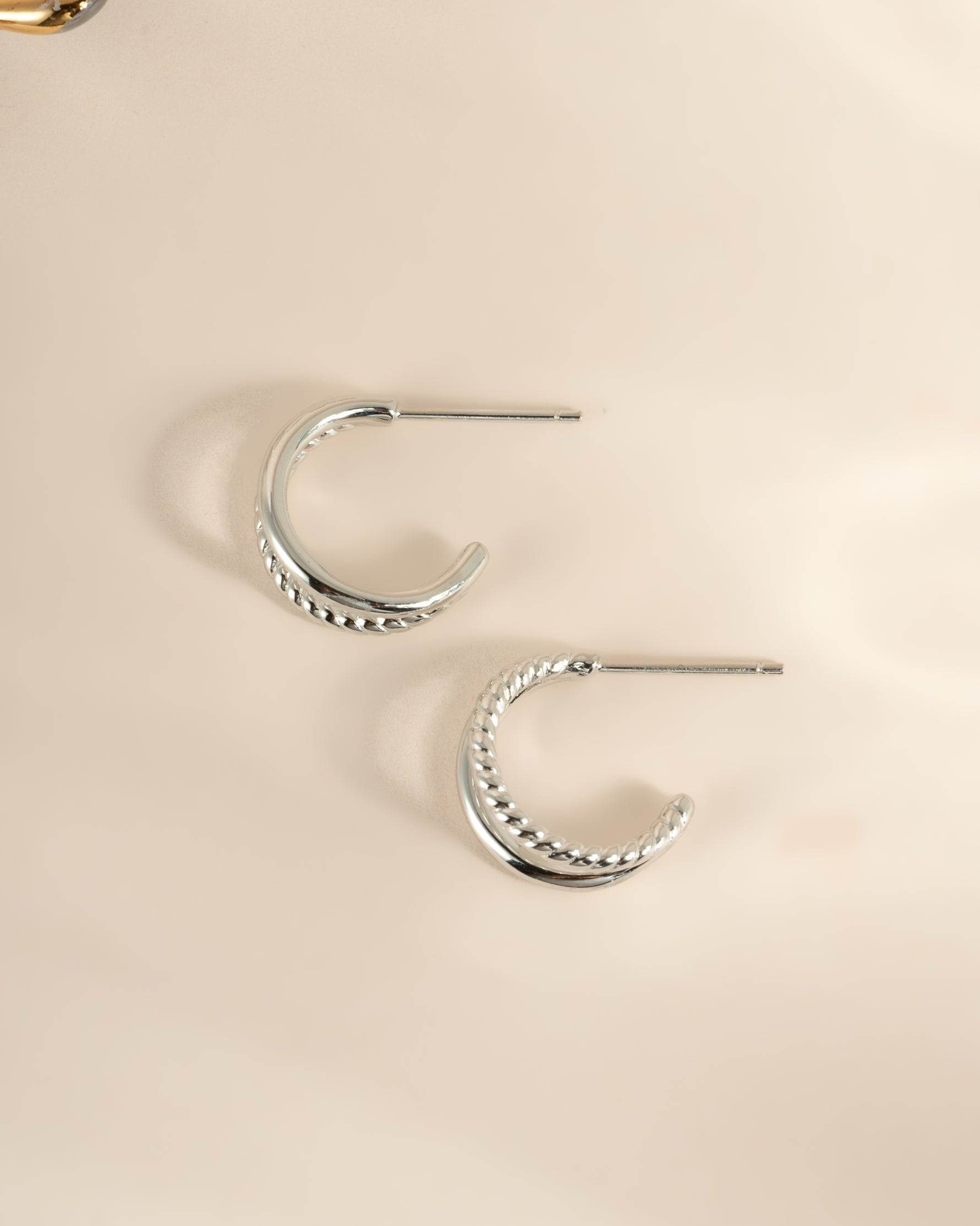 Sami Jewels Stella Hoop Earrings in sterling silver, double-hoop design, side view showing shiny, polished finish and classic style.