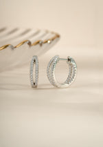 Sterling silver double hoop earrings from Sami Jewels, featuring layered, modern hoop design for stylish everyday wear.
