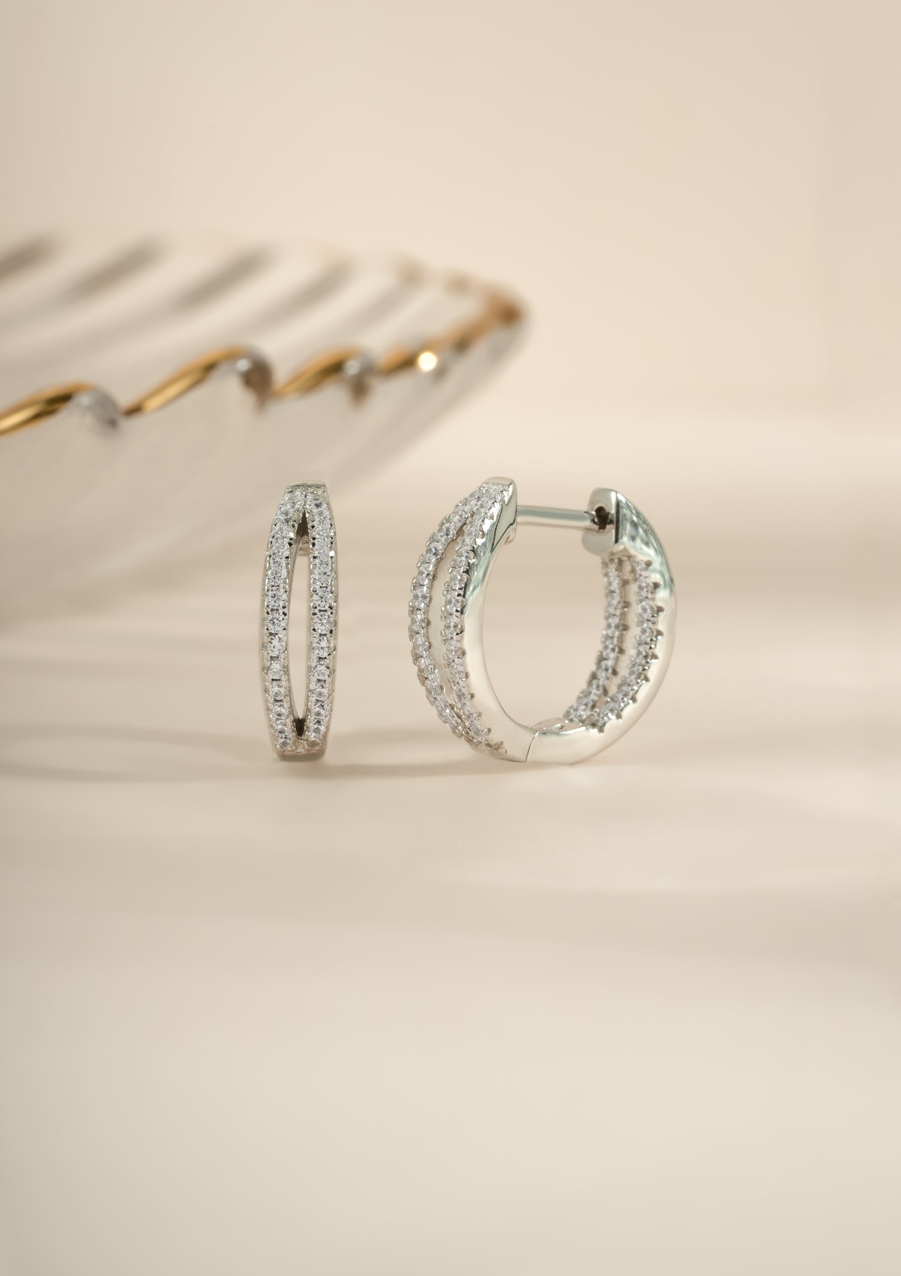 Sterling silver double hoop earrings from Sami Jewels, featuring layered, modern hoop design for stylish everyday wear.