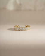 Gold double row CZ ear cuff earrings by Sami Jewels, front view showing sparkling diamond-like stones on the cuff.
